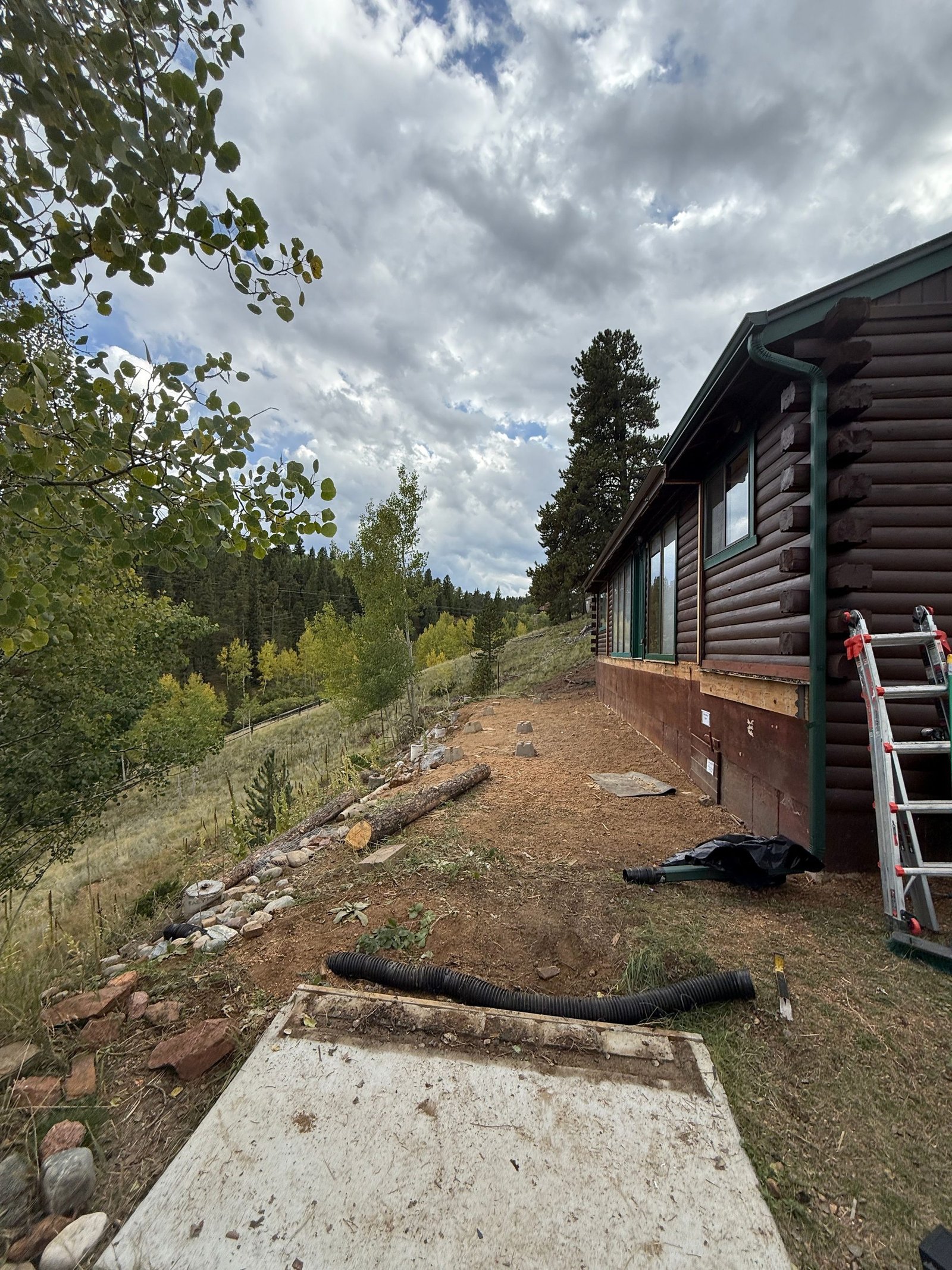 Hillside cut and prepared pad before deck construction at a Colorado foothills home